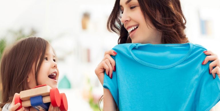 Mother and daughter laughing