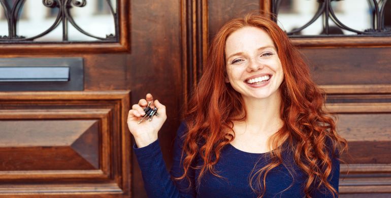 Women with keys smiling