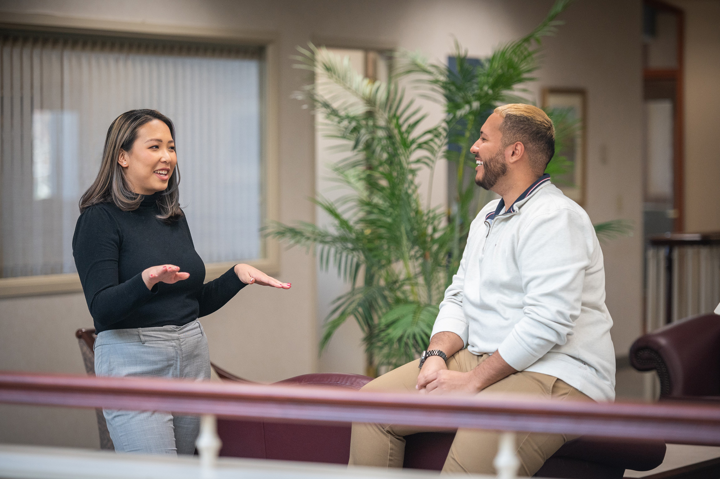 Two young professionals discussing career options