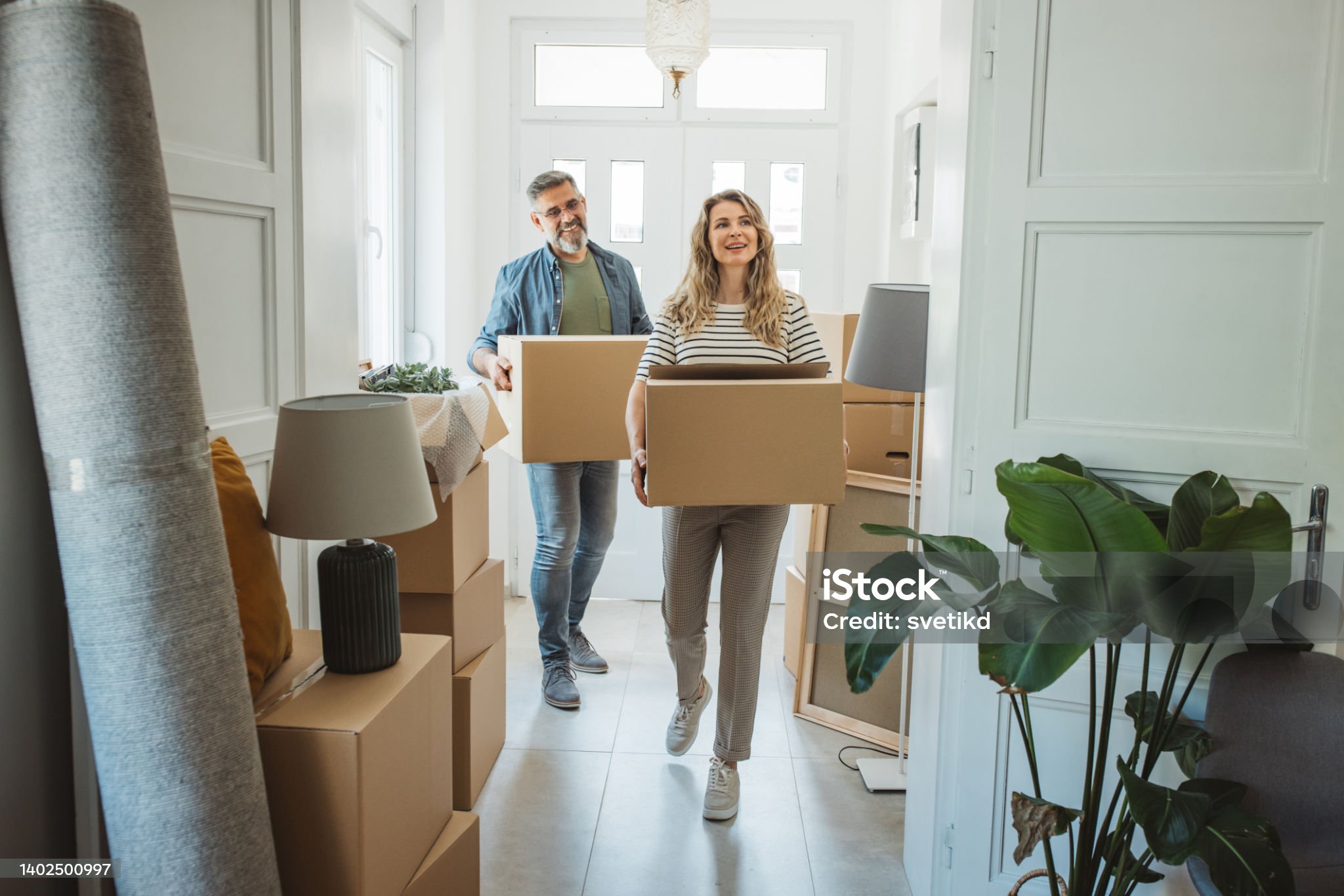 Happy young couple moving into new home