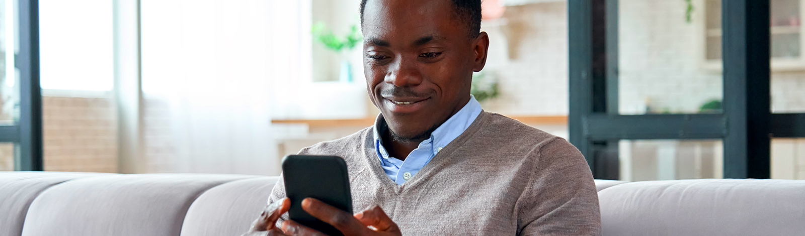 Man smiling at phone