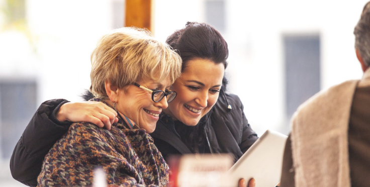 Two woman smiling