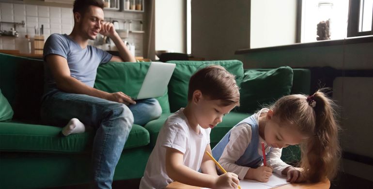 Family of three together in living room