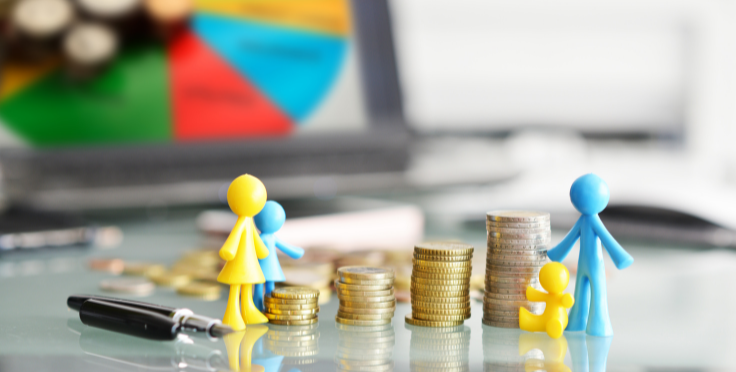 Coins line up with small figurines depicting a family
