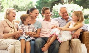 Family sitting together and smiling