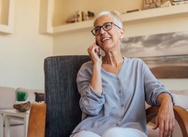 Women talking on the phone and smiling