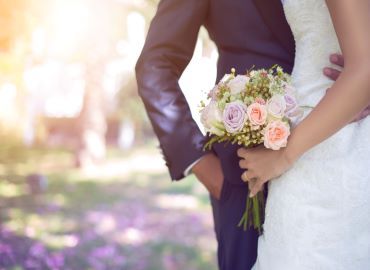 Picture of bride and groom holding bouquet